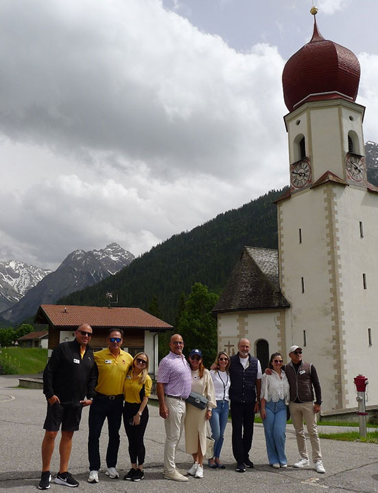 group by pretty building in the alps