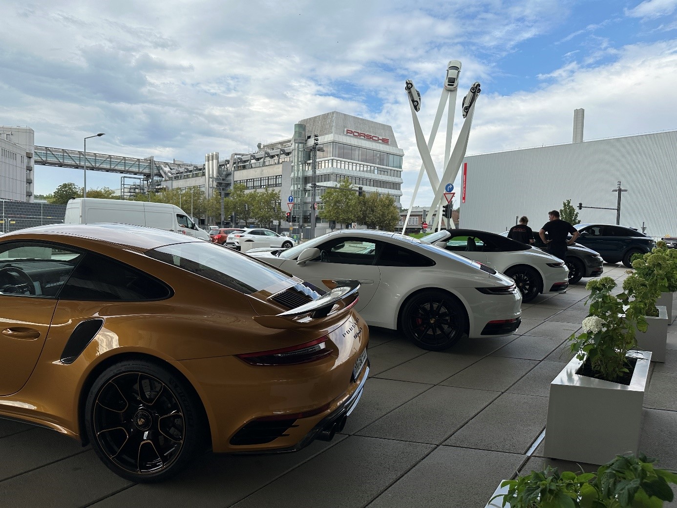 Porsches lined up in parking lot at the Porsche factory